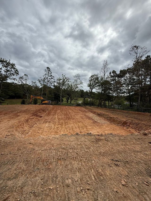 Finish-graded lot under a dramatic mountain sky, western North Carolina